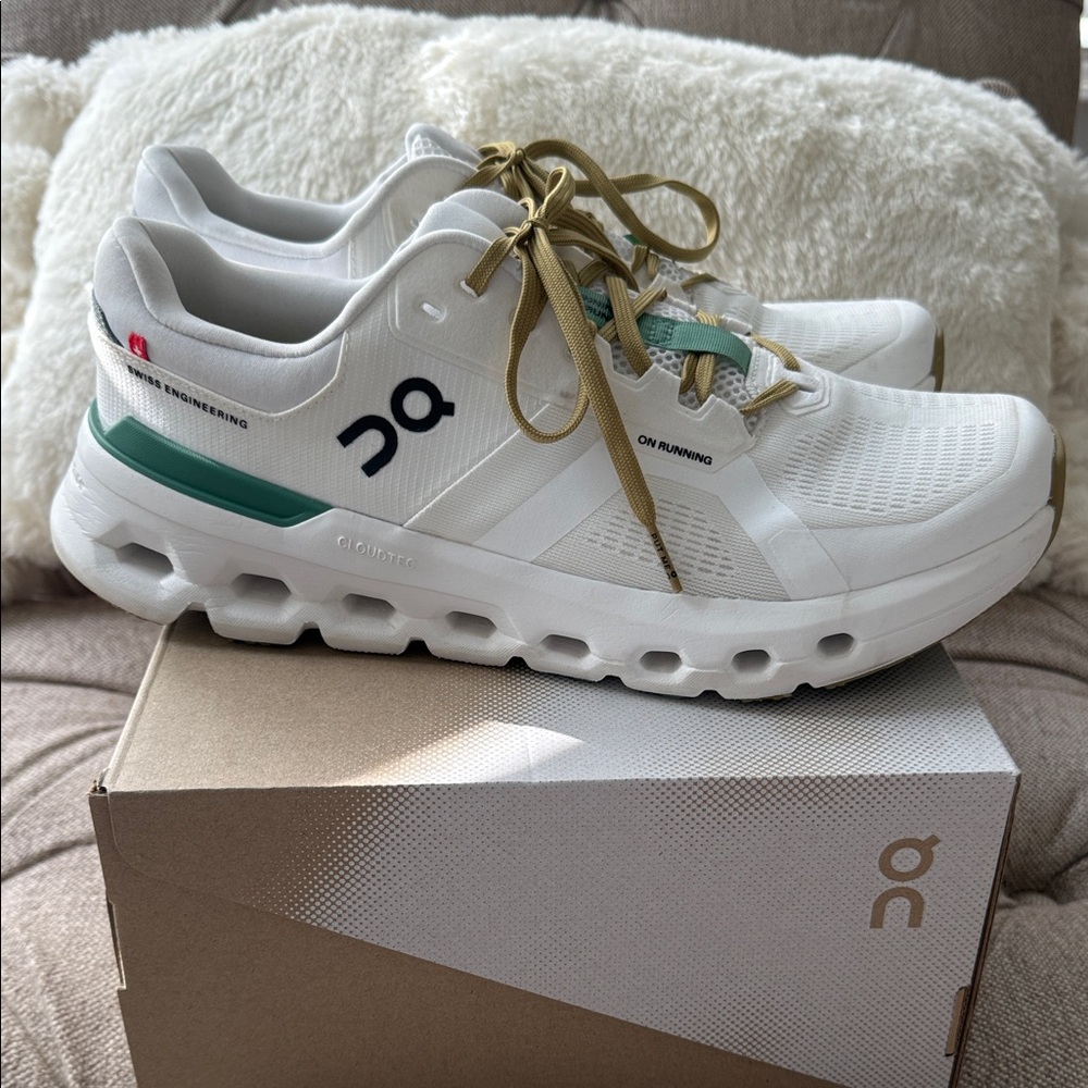 On Running White Sneakers with Gold and Green Accents